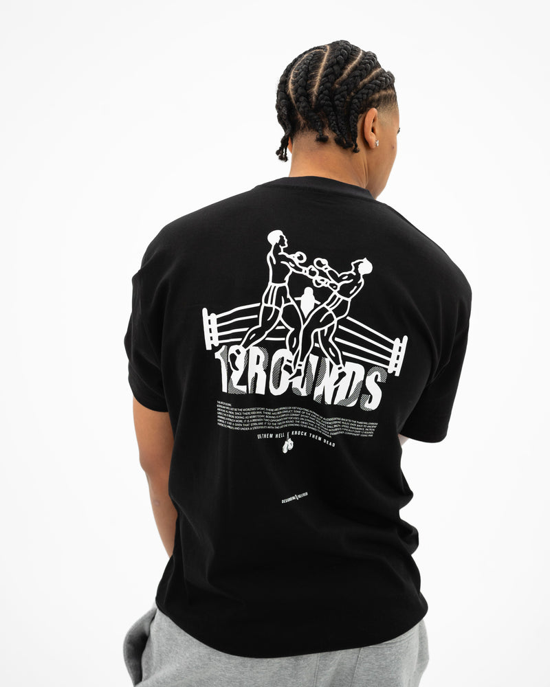 R&T 12 Rounds Heavy T-Shirt — rear graphic upper body shot on male model
