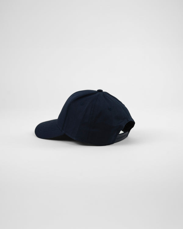 A navy vintage style baseball cap with 'R&T' embroidered on the front. six-panel baseball cap with a curved peak and snapback fastening, featuring 'R&T Join The Club' embroidery on the front.