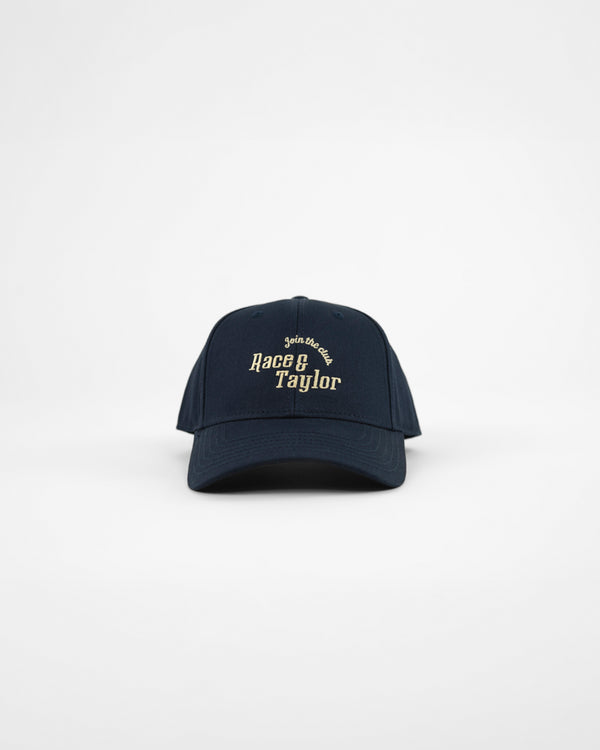 A navy blue baseball cap with a curved peak and R&T embroidery on the front.
